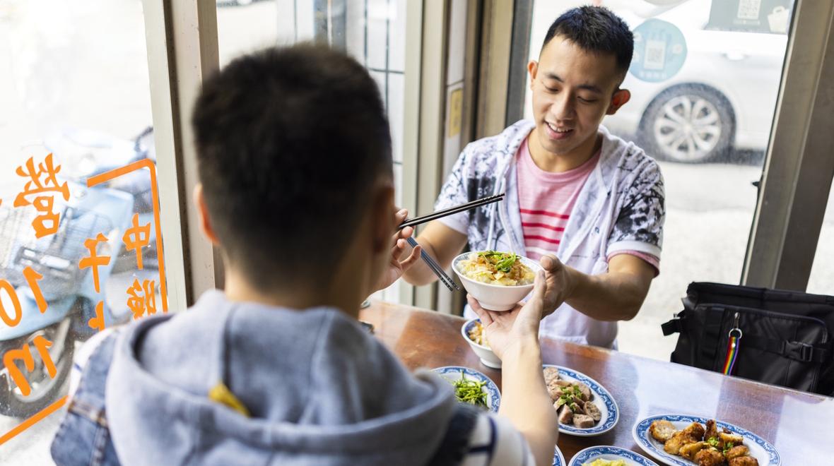 Couple enjoying Chinese food on a summer date night