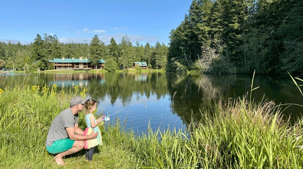father and daughter fishing on the lake at Lakedale Resort, a family-friendly resort with a lodge and cabins
