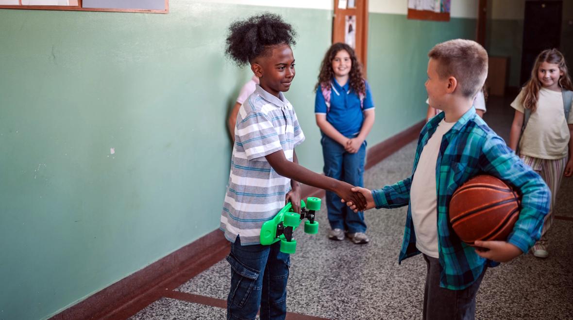 kids shaking hands at school