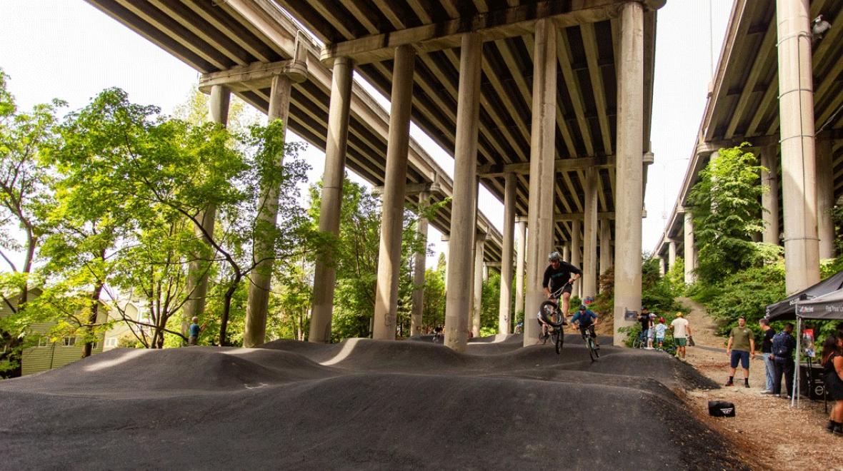 bikers on the new pump track at I-5 Colonnade Park in Seattle