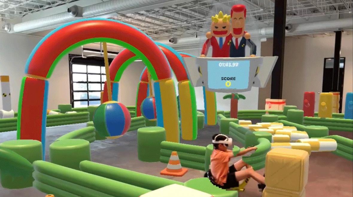 young boy wearing VR headseat at DreamPark Seattle playing an immersive video game