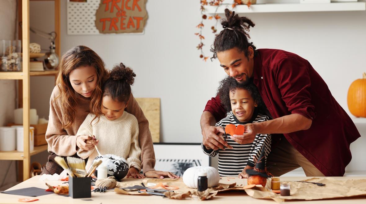 family working on Halloween craft projects