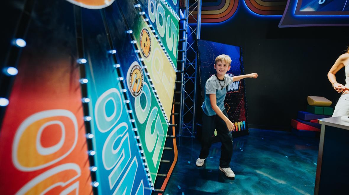 Child with the big spinning wheel at the Great Big Game Show