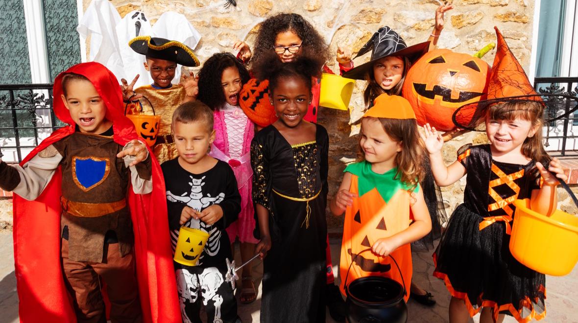 Group of kids in Halloween costumes 