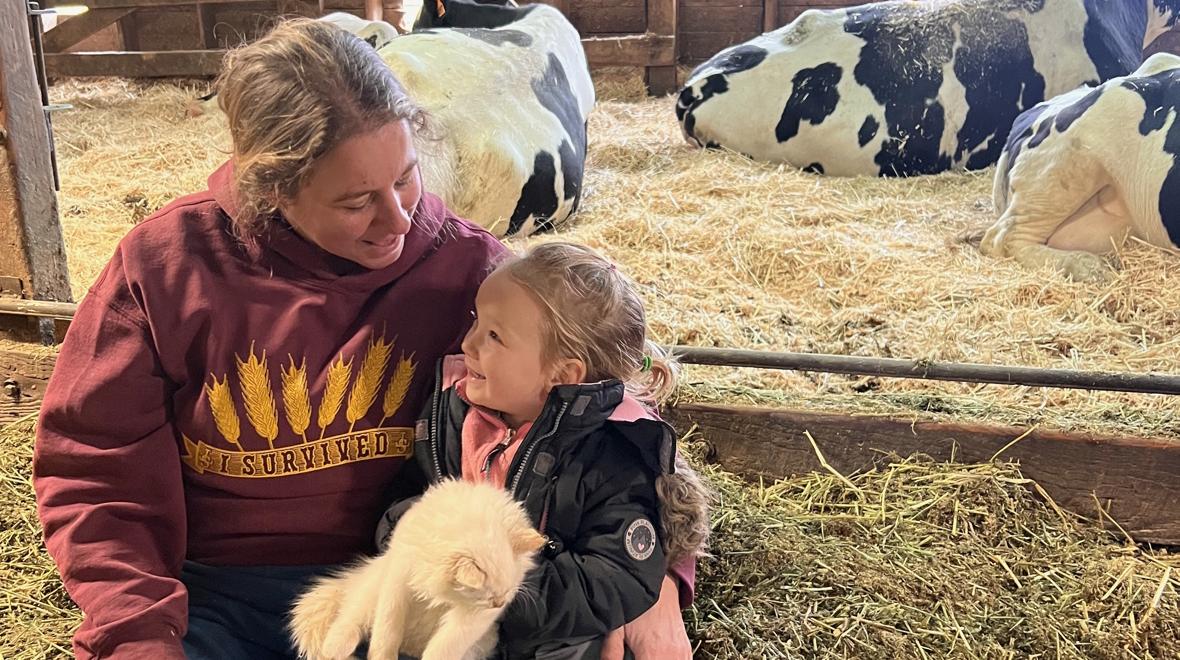 Grandma Lori with Evangeline with the cows in the maternity area