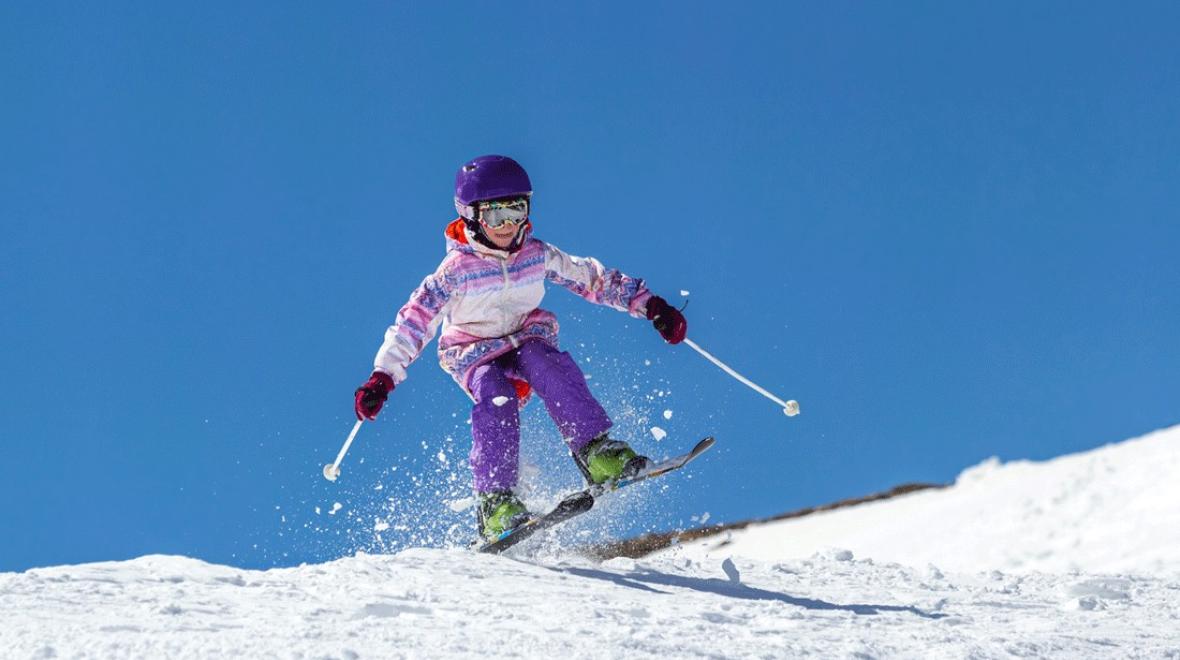 young girl skiing near Seattle over winter break, a fun family activity