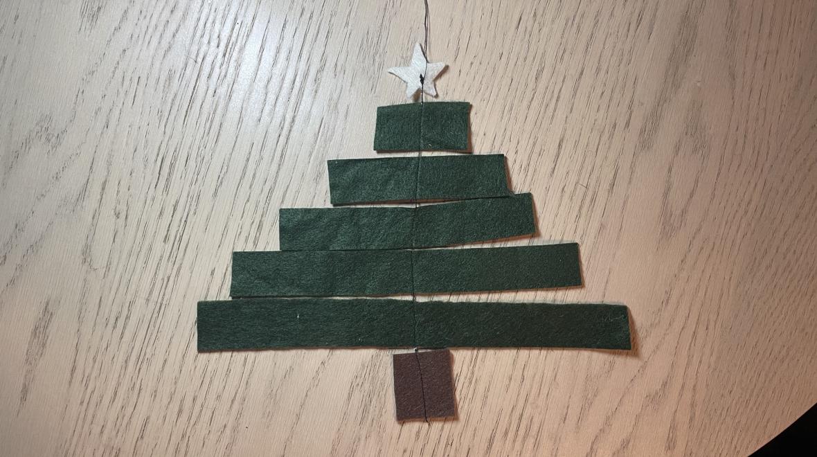strips of felt sewed together to make a Christmas tree ornament