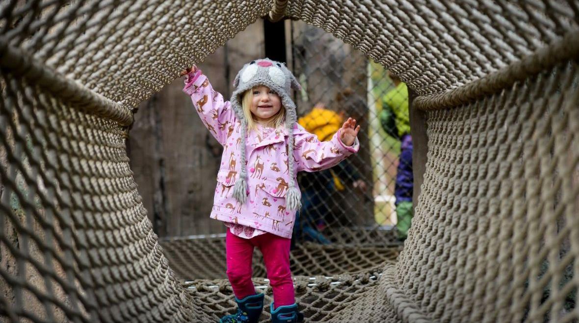 little girl playing in the nets
