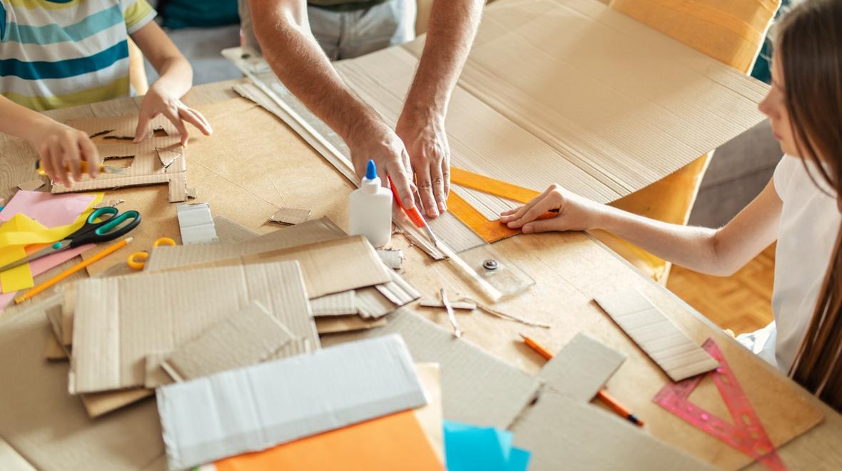 cutting up cardboard to make stackers