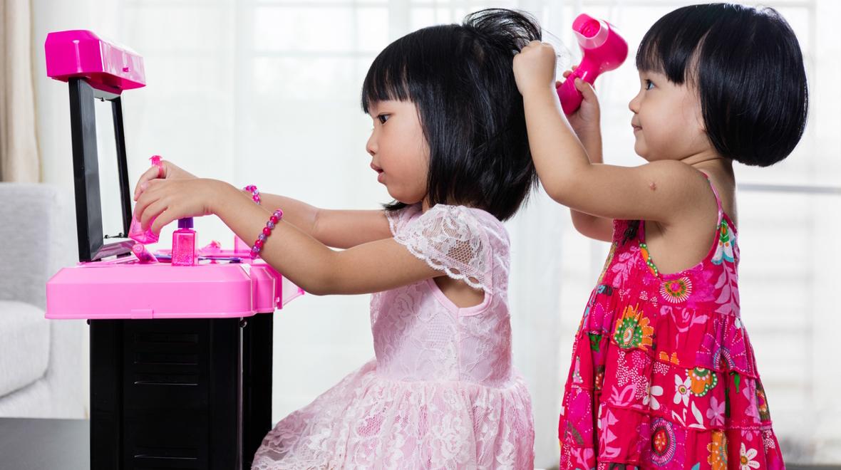 sisters playing pretend