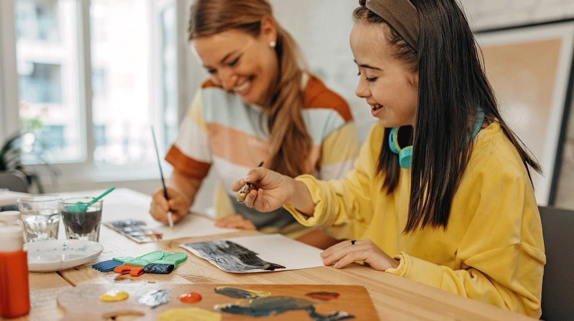 young girl painting during a sensory-friendly outing in Seattle