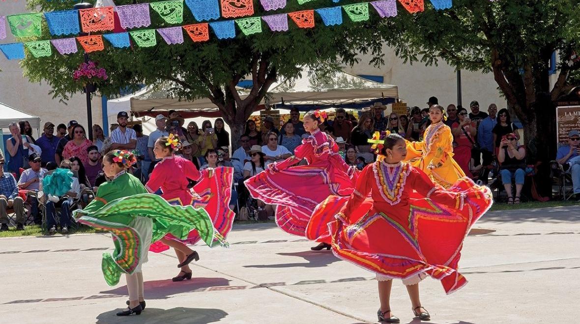 girls perform traditional dance in town square at festival