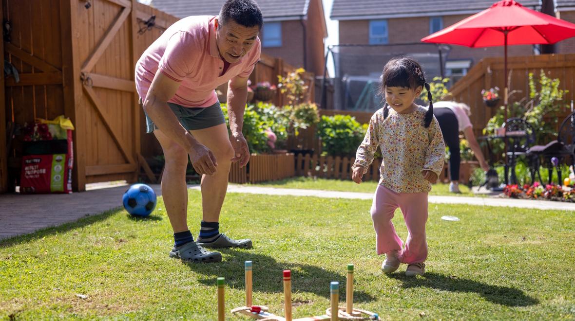grandpa and girl playing yard games
