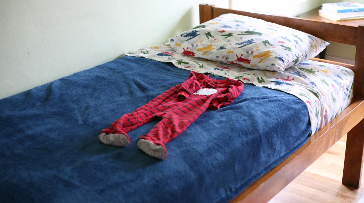 Kid's bedroom with child's onesie