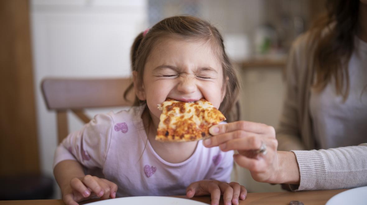 A child enjoying pizza