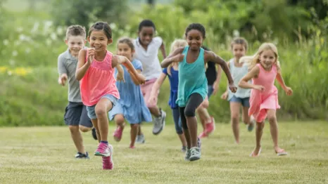 Group of kids running in a field benefits of running
