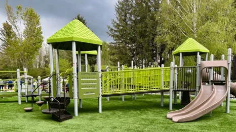 New playground structures at Centennial Fields Park in Snoqualmie offer mountain views and accessible play.