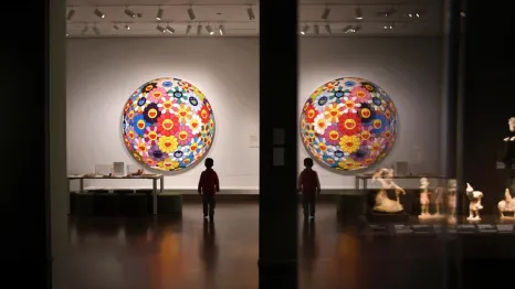 young boy walks in the Seattle Asian Art Museum, a local museum you can visit for free or at a discounted rate