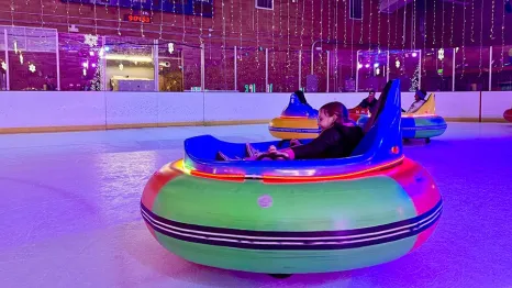 A kid spins in an ice bumper car at Sprinker Rec Center in Tacoma during ice lights