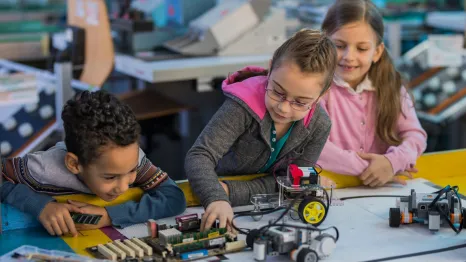 kids working on a robotics project at a mid-winter camp