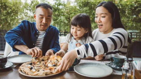 Family enjoying pizza at one of the best Seattle pizza places