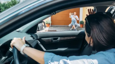 mom dropping off child with dad