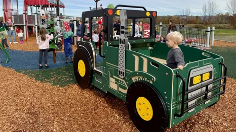 A child at a farm themed playground near Seattle on a sunny weekend