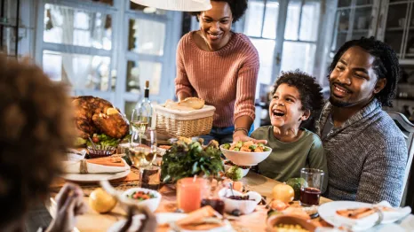 happy family at Thanksgiving table