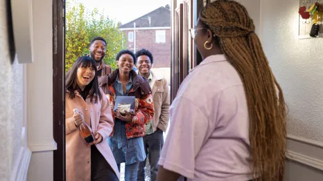 group of friends arriving at a holiday party