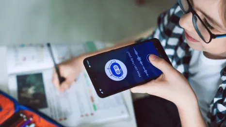 Boy using system AI Chatbot on mobile application