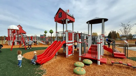kids playing at the Van Lierop Park playground, one of the newest Puget Sound playgrounds to open in 2025