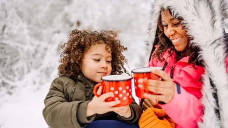 mom and son drinking hot chocolate together