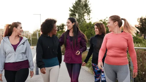 A group of women walking and talking
