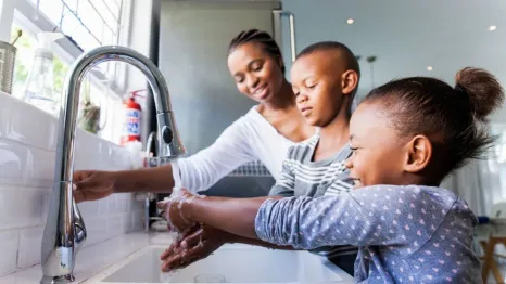 Family washing their hands together