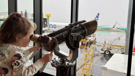 young girl watching planes at Paine Field