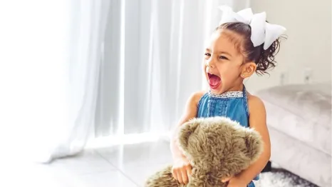 screaming little girl toddler playing at home