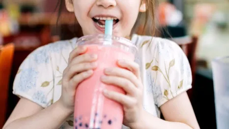 little girl drinking boba bubble tea