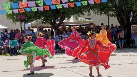girls perform traditional dance in town square at festival