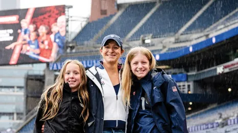 stephanie cox with her daughters in the field