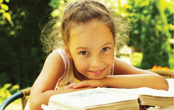 Young girl reading a book