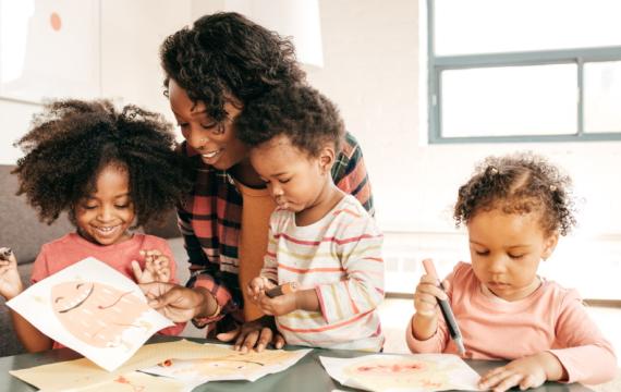 Kids working together to make a birthday party craft idea