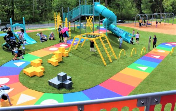 View of colored game-board pathway at newer West Fenwick park playground near Seattle best playgrounds kids families