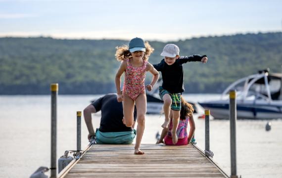 kids-running-on-dock-in-summer