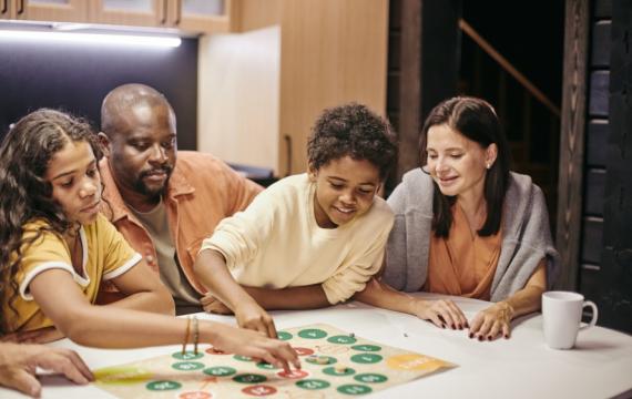 Family playing a board game together