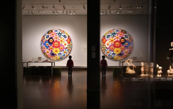 A young boy stands looking at a large art work at the Seattle Asian Art Museum guide to visiting Seattle museums for free