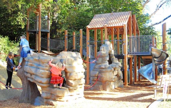 Kids play on the playground equipment at Seattle's Seward Park, ParentMap's playground of the week and a great place for weekend activities kids and families