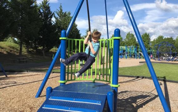 a boy plays on a playground, things to do this weekend in seattle