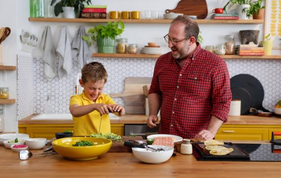 Joel Gamoran and his son having fun in the kitchen 