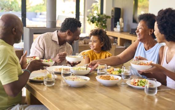 family sitting around a table eating together