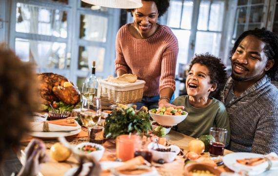 happy family at Thanksgiving table